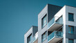 © JB - modern apartment grey building with gray tiles, minimalistic geometry, gray facade, glass balconies, contemporary urban residential architecture background. 3d illustration.