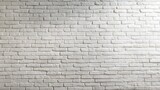 White brick wall texture with soft shadows, creating a subtle architectural depth.