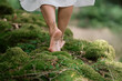 © Thilo Wagner - Barefoot walk through forest moss, female feet in close-up, enjoying nature and a grounding moment