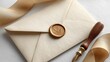 © twilight mist - Cream-colored envelope with gold wax seal and ribbon.