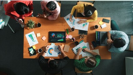 Wall Mural - top view of smart businessman present marketing idea at meeting while group of investor listening an