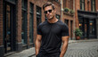 © miracle - Male model in a classic black cotton T-shirt on a city street