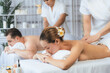 © InfiniteFlow - Caucasian couple customer enjoying relaxing anti-stress spa massage and pampering with beauty skin recreation leisure in day light ambient salon spa at luxury resort or hotel. Quiescent