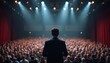 © miss irine - Man in suit speaks on stage under bright spotlights to large audience in packed auditorium. Communication, business, leadership, motivation, event, conference, seminar themes.