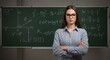 © Architect  Mo  - Confident Math Teacher PosingA young woman wearing glasses is standing next to a chalkboard. Complex Equations Background