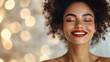 © VinakMotion - Smiling woman with curly hair against a blurred festive background, radiating joy