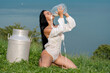 © Volodymyr - Female model with dripping milk on sexy body. Woman drink milk from bottle near Swiss Alps. Woman drinking milk from bottle. Milky lingerie. Splashed milk. Model with milky splash. Milking.