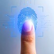 © Setia Fitra - Fingerprint scan on human finger with digital security, identity and access control concept