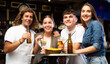 © JackF - Portrait of happy friends in a beer bar chatting and drinking beer