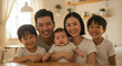 © farah - Heartwarming Asian Family Portrait: Parents and Children in a Bright, Cozy Home Setting