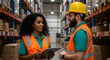 © Karmiyem - Warehouse workers, a man and woman, discuss inventory and logistics in a modern distribution center, ensuring efficient operations and supply chain management.