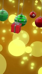Wall Mural - animation of christmas baubles decoration and glowing spots on brown background