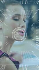 Wall Mural - in office, businesswoman analyzing digital data with animated processing overlay