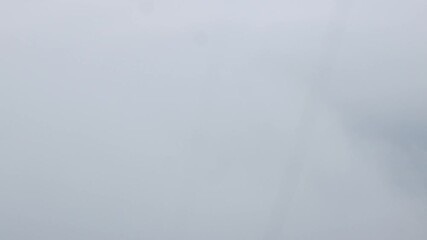 Wall Mural - Aerial view above the clouds and sky inspiration concept in cinematic breathtaking aerial flying over white fluffy cloudscape in high altitude sky with fresh clean air and blue skies on background.