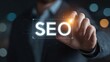 © Ірина Пальцева - Concept of Search Engine Optimization with a male executive in a suit holding a virtual SEO interface with his fingertips.