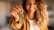 © PengAI - A smiling woman holds out a set of keys toward the camera, symbolizing new homeownership or opportunity.