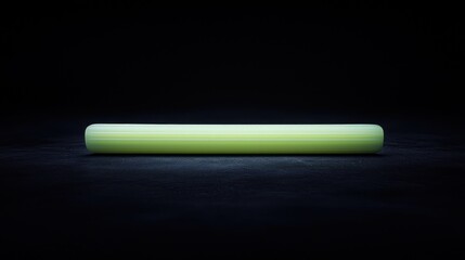 Wall Mural - Glowing green cylinder, dark background, product display, studio shot