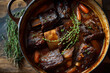 © Sajjad - Braised short ribs with carrots and thyme in a cast iron pot