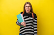 © luismolinero - Young student woman isolated on yellow background background with surprise facial expression