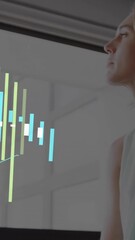 Wall Mural - in office, businesswoman analyzing financial data using animation on computer screen