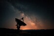 © Lady O - A radio telescope in a data bank wide field with stars and comets overhead at night with Milky Way galaxy is visible on the horizon.