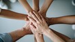 © YuDwi Studio - Stack of hands showing unity and Teamwork: Diverse Hands Joined Together