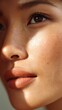 © Enigma - Close up beauty portrait revealing porcelain skin, highlighting natural makeup and subtle freckles, glowing under soft, flattering illumination