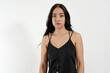 © HC FOTOSTUDIO - Young latin woman posing with neutral expression on white background