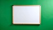 © khoirurizal1 - Blank White Board with Wooden Frame on Vibrant Green Wall