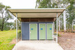 © Wittke Photography - Photograph of a small outdoor public toilet block amongst trees in public parkland in Yarramundi Reserve in the Hawkesbury Region of NSW, Australia.