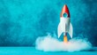 © Working Moments - Toy Rocket Launching on Blue, startup , space