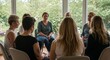 © Анастасия Макевич - Women sitting in circle sharing during group meeting