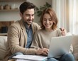 © Pete - Young couple, new homeowners, manage finances using laptop. Smiling woman, man review documents for taxes banking at home. Wireless technology, online banking facilitate financial planning together.