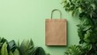 © Jpeg - Sustainable paper bag, surrounded by greenery