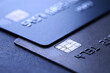 © New Africa - Different credit cards on black table, closeup