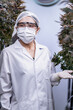 © ultramansk - A scientist inspects cannabis plants in a controlled indoor farm for quality assurance and research. Medical marijuana cultivation advances through innovation, biotechnology, and sustainability.