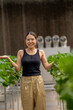 © ultramansk - A woman enjoys picking fresh strawberries in a modern greenhouse. Sustainable farming ensures high-quality, organic fruit production for healthy eating and eco friendly agriculture practices.