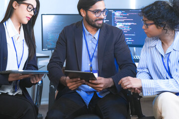 diverse team of software engineers and data scientists collaborating on a project, using tablets and