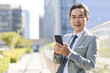 © Blue Jean Images - Mature businessman holding smart phone