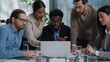 © Yuliia - Multiethnic business team women men teamwork in office desk talking planning discuss laptop online project company corporate work colleagues Indian Caucasian African American businessmen businesswomen