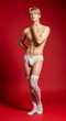 © Poetra RH - Asian male model wearing lace thong & stockings for men. Seductive and daring, perfect for intimate occasions, cosplay, or bold fashion statements.