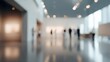 © IKM - The blurred elegance of an art gallery filled with visitors exploring exhibitions.