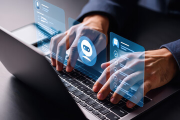 Person typing on a laptop with ai chatbot and email icons displayed in a futuristic interface