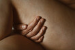© Westend61 - Hand touching hip and leg in sensual intimate body positive close up
