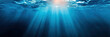 © alexkoral - background with underwater blue water in sea and sunrays on surface with ripples