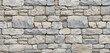 © Viktor - Seamless pattern of textured stone wall in various gray, beige shades. Natural rough rock blocks arranged in staggered rows create classic, durable building material background. Perfect for