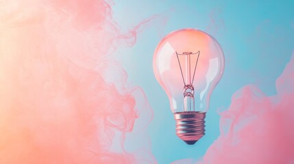 Wall Mural - glowing lightbulb in pastel pink and blue smoke.