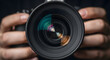 © Passionwith - Close-Up: Camera Lens in Hand, Ready to Capture