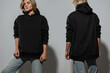 © blackday - Confident Woman Wearing Oversized Black Hoodie with Blank Space for Mockup