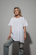 © blackday - Confident Woman Wearing Oversized White T-Shirt with Blank Space for Mockup
